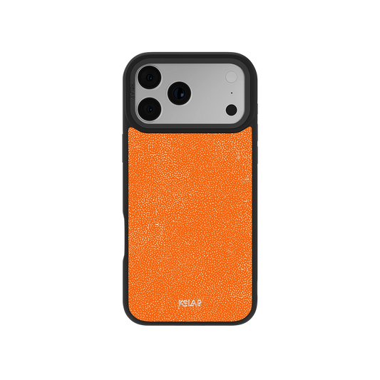 Stipple Electric Orange iPhone Case with fine grain texture and bold industrial design, shown on a phone with black bumper edges.