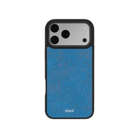 Blue Micro Dotted iPhone Case by KELAB featuring a digital grain texture with vibrant blue and orange dots, designed for modern smartphone protection.