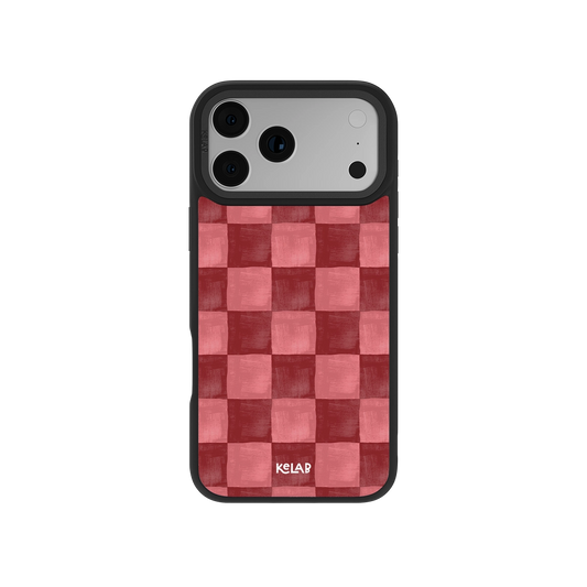 Red checkered iPhone case with MagSafe, textured anti-slip surface, and drop protection edges.