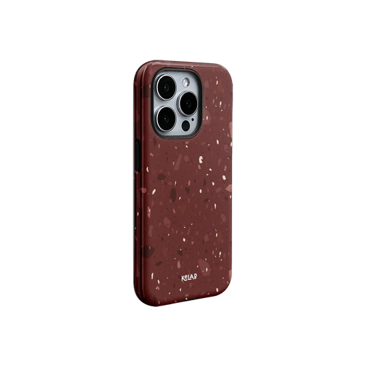 Chic wine red terrazzo iPhone case with glossy finish and minimal pattern, offering a luxury aesthetic and precise fit.