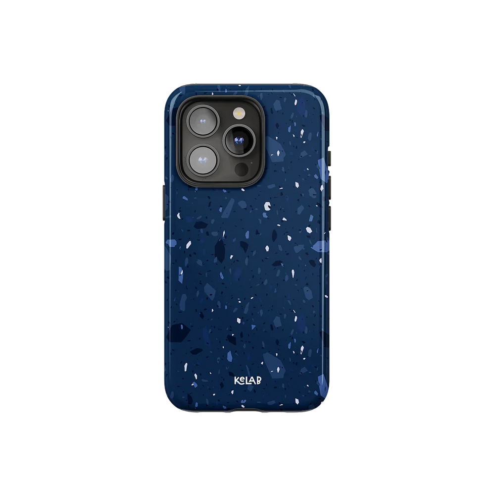 Navy blue marble terrazzo phone case by KELAB with periwinkle and sky blue speckles, designed for iPhone with a sleek glossy finish.
