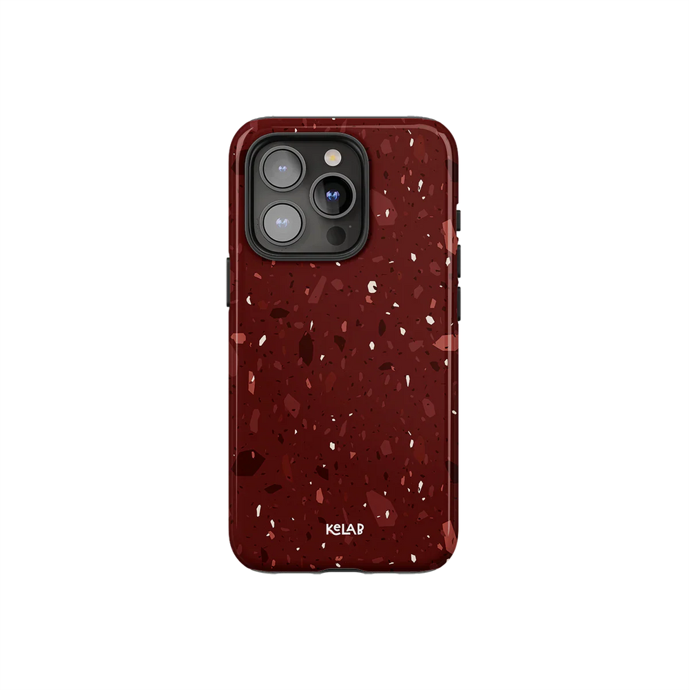 Burgundy marble terrazzo phone case by KELAB with crushed garnet tones and blush flecks, designed for iPhone with camera cutout.