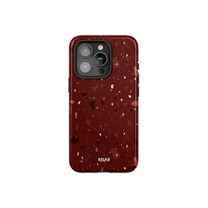 Burgundy marble terrazzo phone case by KELAB with crushed garnet tones and blush flecks, designed for iPhone with camera cutout.