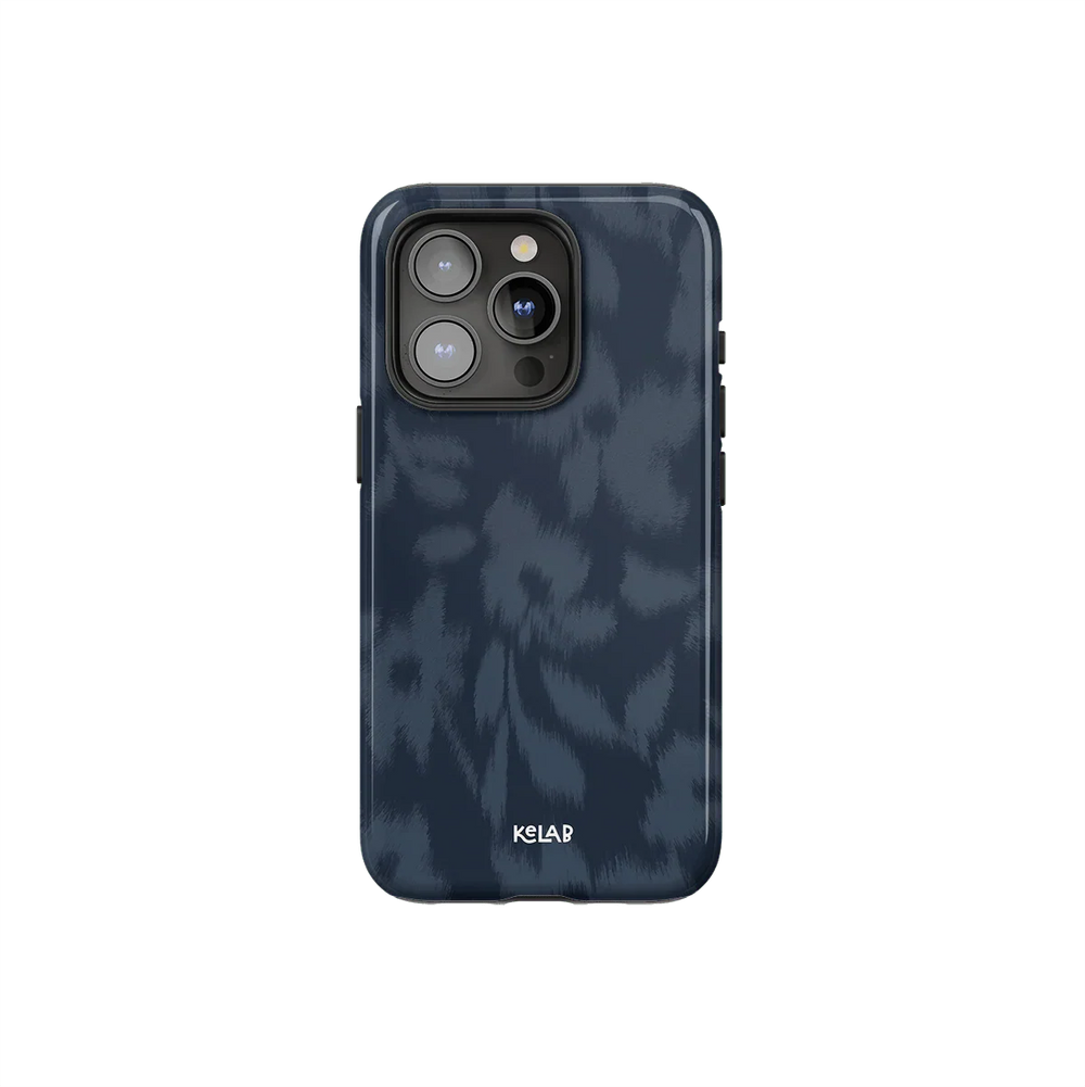 Blue floral phone case with blurred flower texture by KELAB, featuring a moody navy design and glossy finish for iPhone protection.