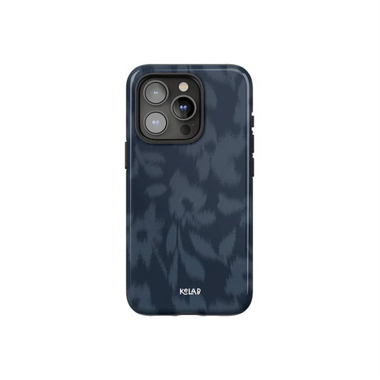 Blue floral phone case with blurred flower texture by KELAB, featuring a moody navy design and glossy finish for iPhone protection.