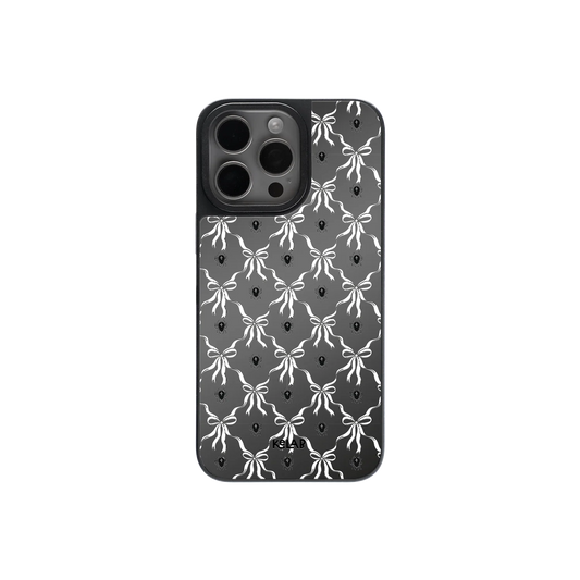 Gothic Halloween phone case with violet bow pattern and mirror back, featuring a black and white symmetrical Victorian design.