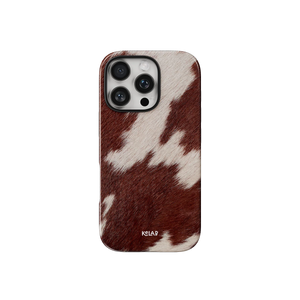 Cow Print Brown iPhone Case by KELAB featuring a brown and white western cowhide pattern with a slim, protective design for stylish phone protection.