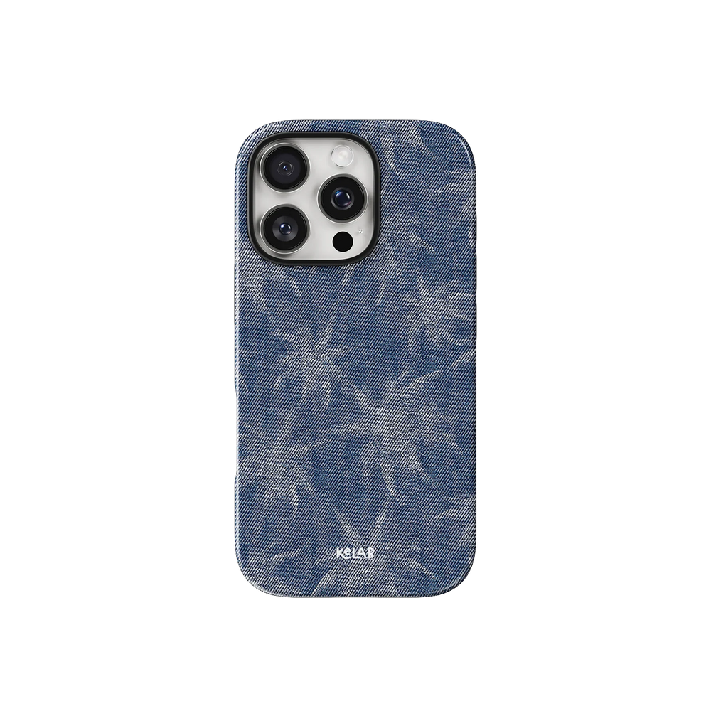 Denim Tree patterned phone case in indigo blue with subtle palm-like design, inspired by jeans. Stylish fit for iPhone with KELAB branding.