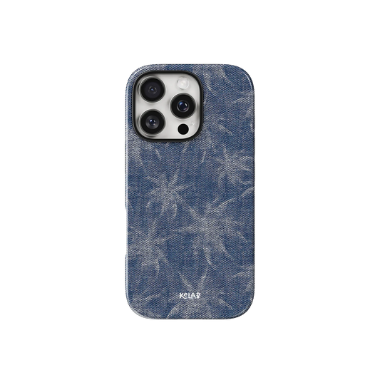 Denim Tree patterned phone case in indigo blue with subtle palm-like design, inspired by jeans. Stylish fit for iPhone with KELAB branding.