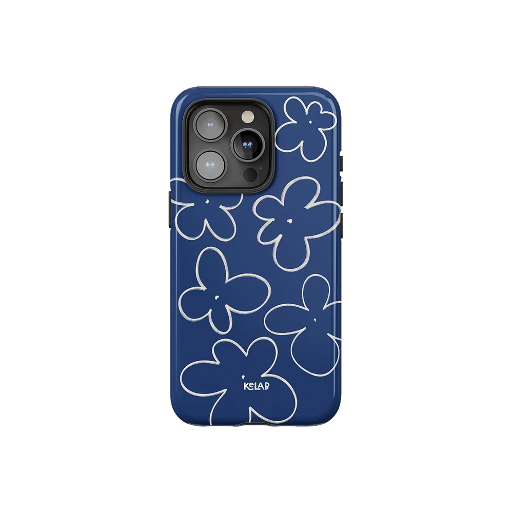 Blue phone case with white sketched floral design in minimalist style by KELAB, offering a chic and vintage-inspired look for smartphones.