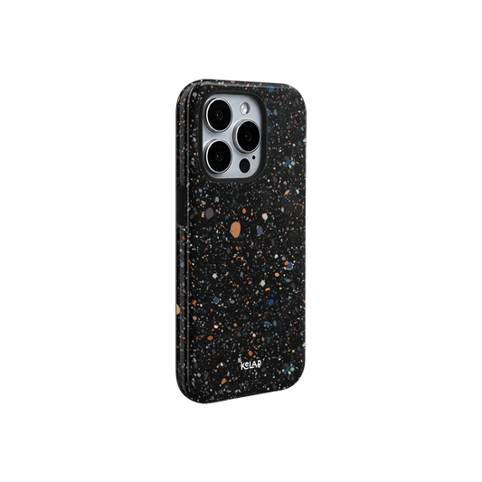 Minimalist black paint splatter phone case with gradient color speckles by KELAB. Sleek side profile with camera cutout for modern smartphones.