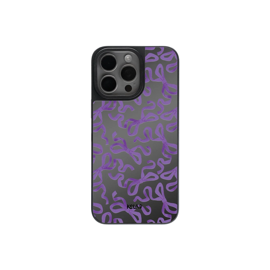 Cute Halloween bow mirror phone case with purple ribbon pattern on glossy black background, perfect for spooky chic and gothic fashion lovers.