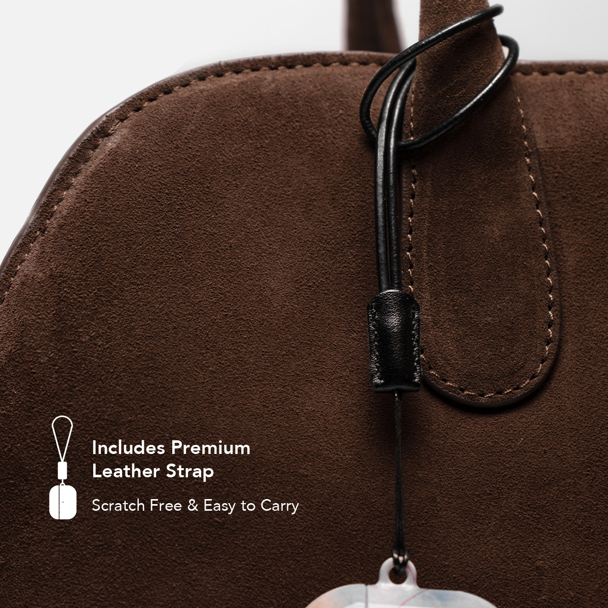 Close-up of premium leather strap included with the AirPods Case, shown attached to a brown suede bag.