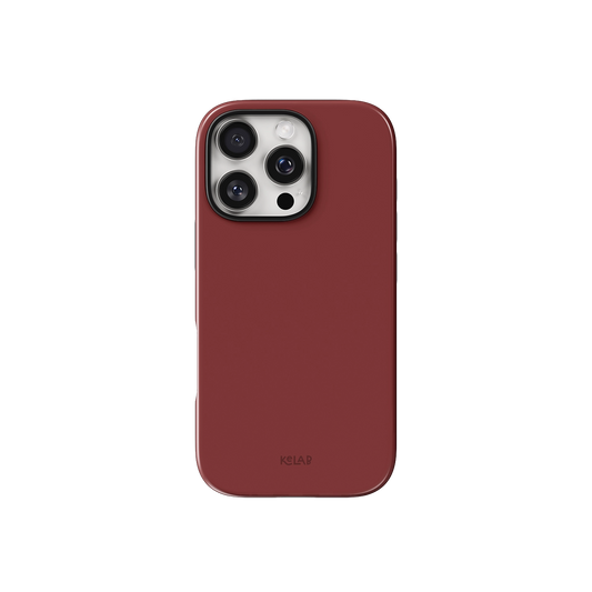 Red Phone Case – Solid Color Minimalist Style by KELAB shown on iPhone with triple camera cutout and glossy burnt red finish.