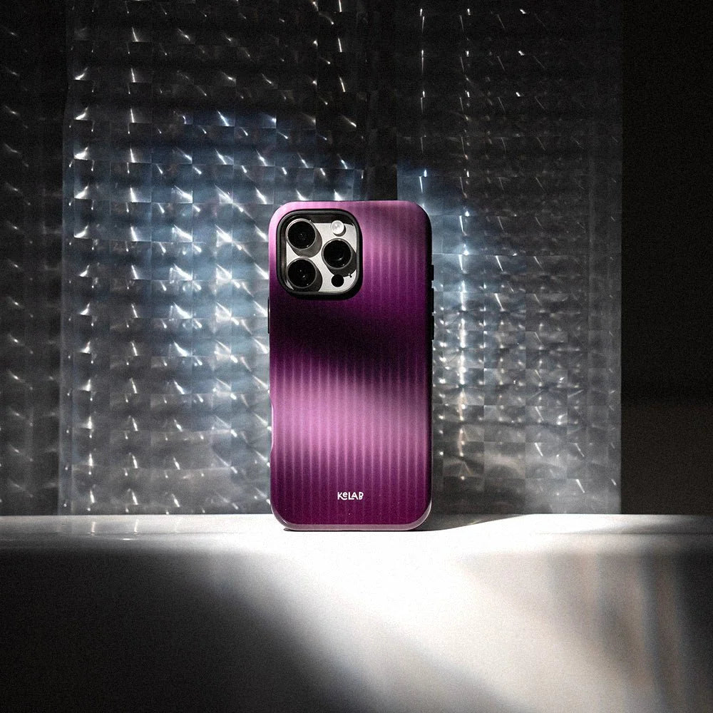 Stylish purple phone case with glossy finish showcased in dramatic lighting, highlighting its elegant minimalist design by KELAB.