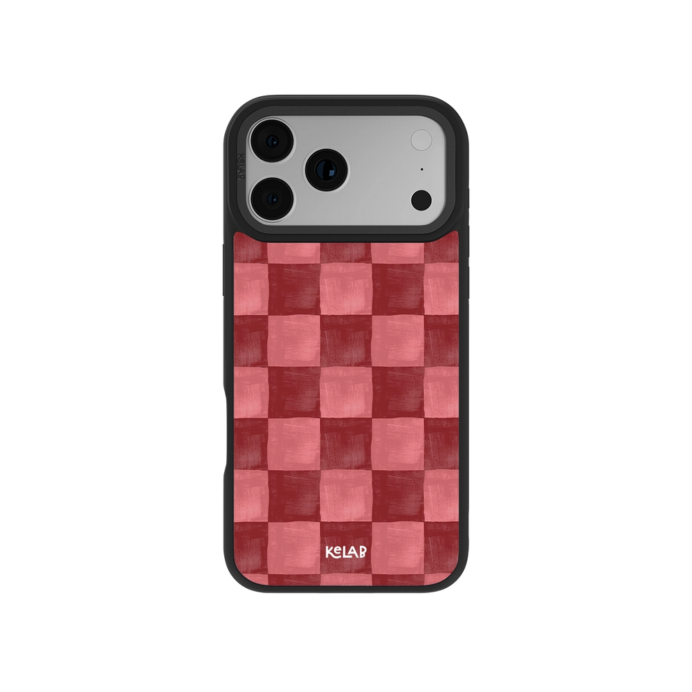 Red checkered iPhone case with MagSafe, textured anti-slip surface, and drop protection edges.