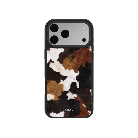 Brown and Black Cow Print iPhone Case by KELAB featuring a realistic cowhide pattern with a sleek black bumper for a rustic Western look.