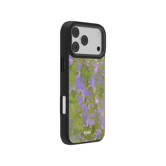 Side view of the Lavender Bloom iPhone Case showing the slim profile and vivid purple wildflower pattern on a green background for aesthetic appeal.
