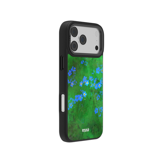 Side view of KELAB's vibrant green floral iPhone case with blue petals, showcasing sleek black edges and precise button cutouts.