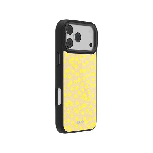 Side view of KELAB's Lemon Drop Yellow Dotted iPhone Case showing minimalist polka dot print and durable black frame for trendy retro protection.