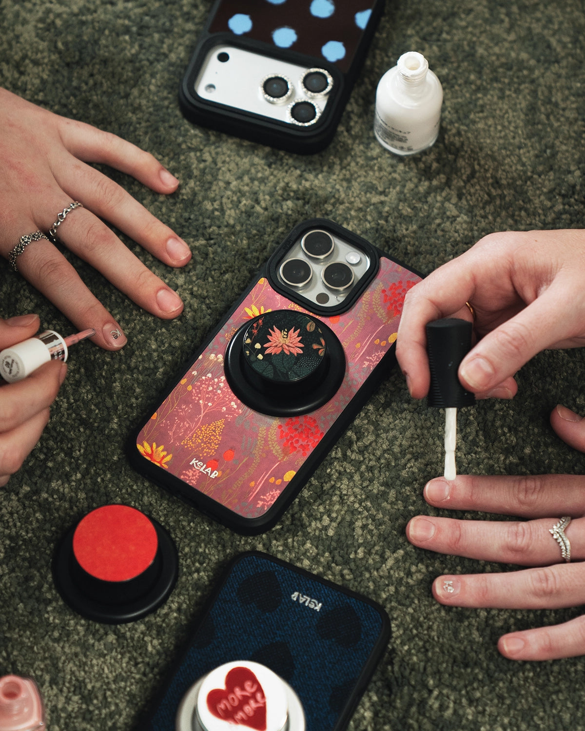 Phone cases with unique designs on a textured surface