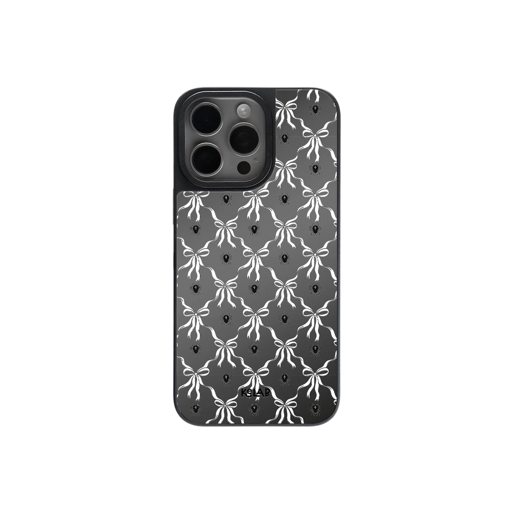 Gothic Halloween phone case with violet bow pattern and mirror back, featuring a black and white symmetrical Victorian design.