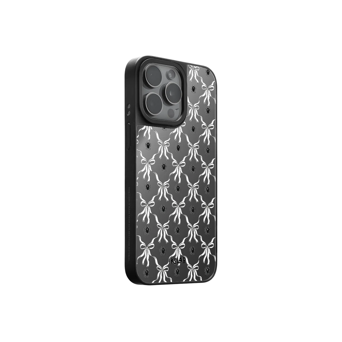 Side view of gothic mirror phone case with white bows on black background, showcasing eerie elegance and high-fashion Halloween style.
