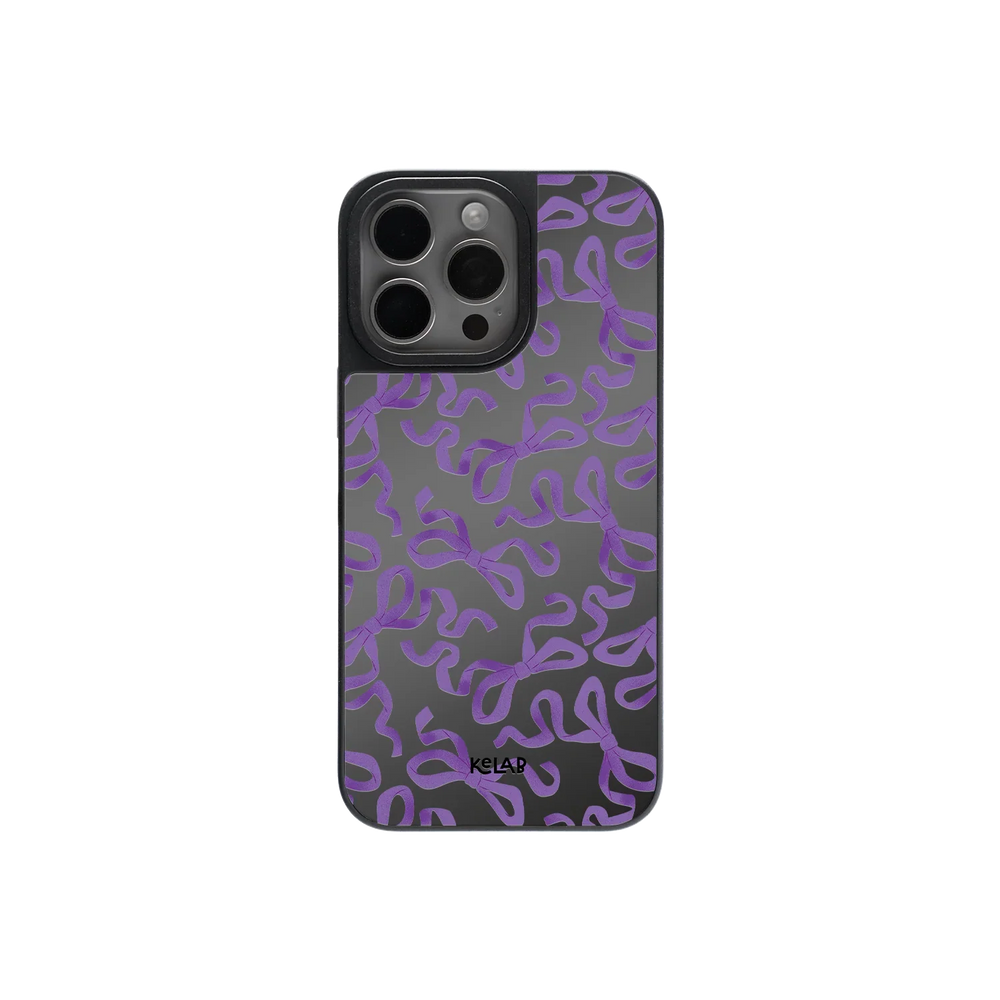 Cute Halloween bow mirror phone case with purple ribbon pattern on glossy black background, perfect for spooky chic and gothic fashion lovers.